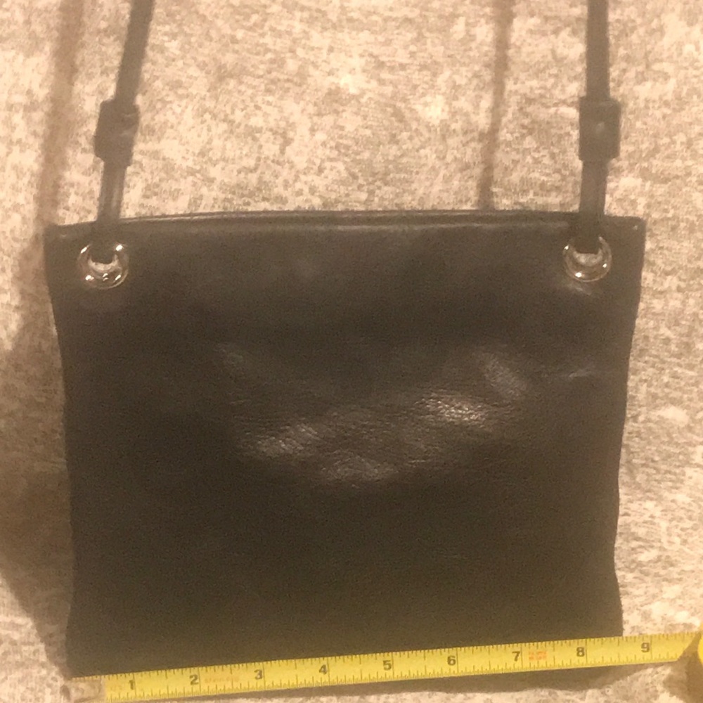 Ladies all black leather purse, no rips or tears.